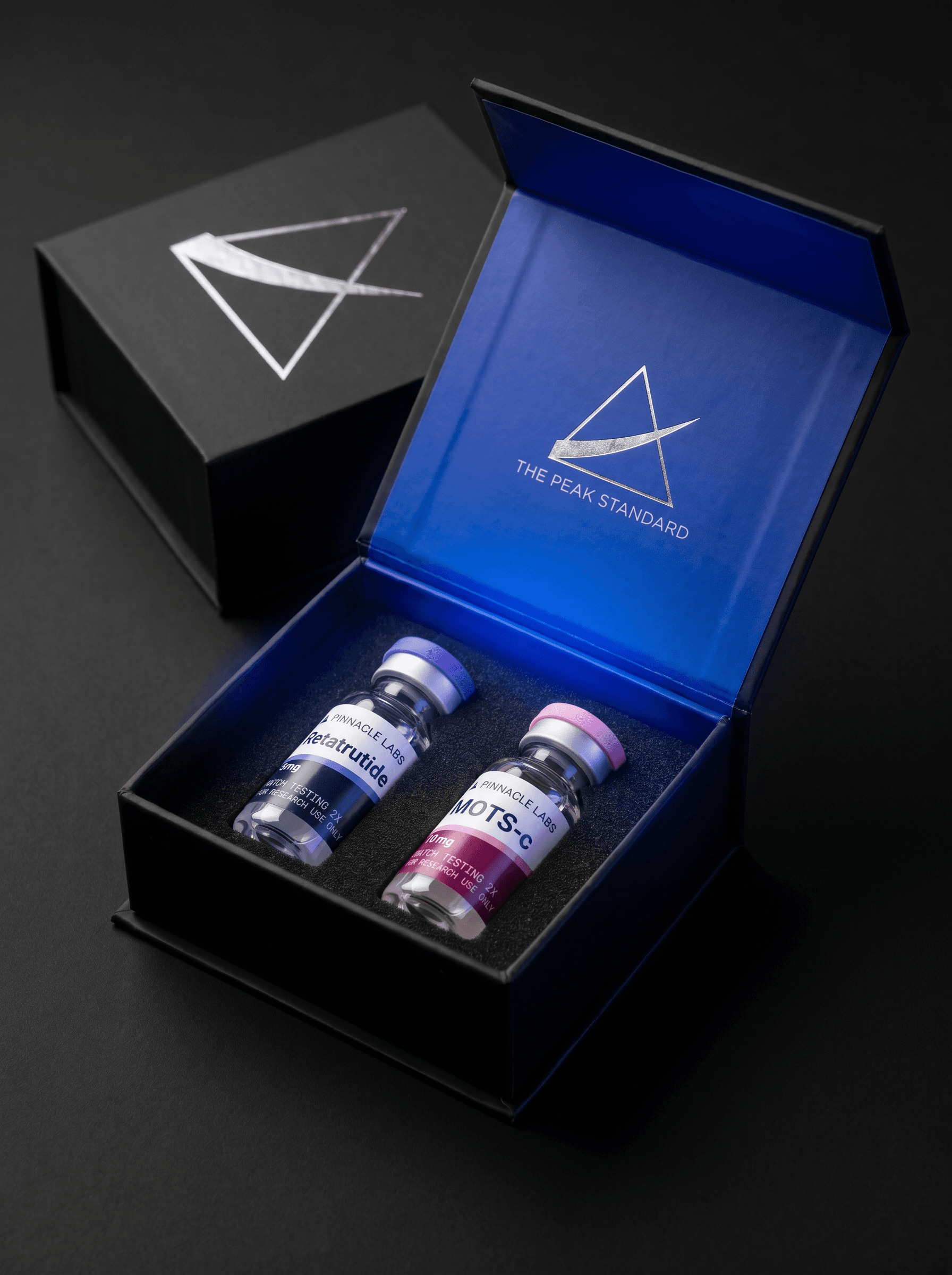 Pinnacle Labs hardcase open — foam-seated research vials in a cobalt-lined box